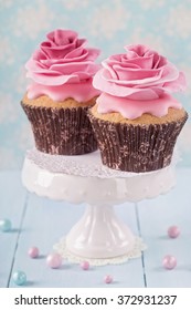 Two Cupcakes With Rose Flowers