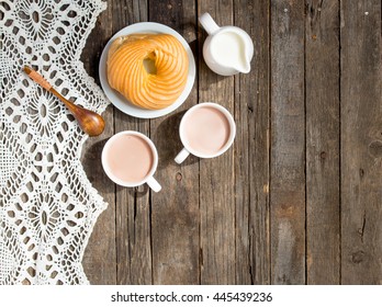 Two Cups Of Cocoa, Jug Of Milk, Donut On A Saucer. View From Above.