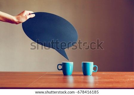 two cups of coffee with blank bubble plate as space for text or dialog 