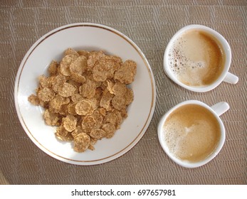 two cups of coffee and cereal