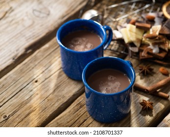 Two Cups Of Coffee And Chocolate Chips, Cinnamon Sticks And Star Anise. Wooden Texture. Close-up. There Are No People In The Photo. Romantic Date, Valentine's Day, Family Breakfast.