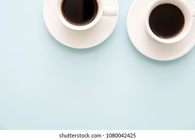 Two Cups Of Coffee On Pastel Blue Table In Minimal Style, Top View. Business Team Work Meeting Concept