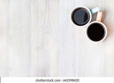 Two Cups Of Coffee On White Wooden Table. Top View, Flat Lay