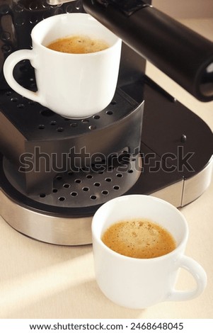 Similar – Image, Stock Photo Two espresso cups under a portafilter of an espresso machine