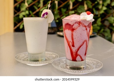 Two cups of milkshake on the table