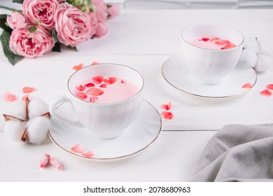 Two Cups Of Pink Matcha. Relaxing Drink To Improve Sleep. Trendy Vegan Tea On A White Background.