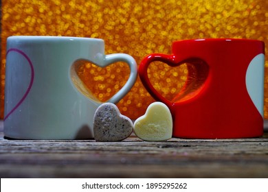 Two cups symbolizing love. Valentine's Day,  romantic symbol of love. Selective focus, blurred backgrounds
