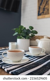Two cups of tea, tea drinking in Scandinavian cuisine. Beautiful cozy home interior photography.