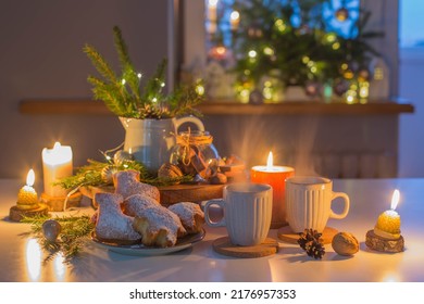 Two Cups Of Tea With Homemade Christmas Baked Goods On Kitchen With Christmas Decoration