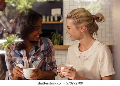 Two customers drinking coffee in the bar - Powered by Shutterstock