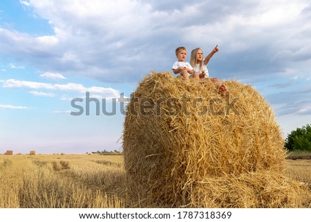 Similar – Vater und Sohn sitzen im Park.