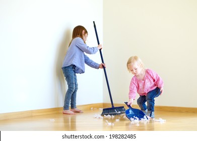 Two Cute Girls Helping Her Mom To Clean Up