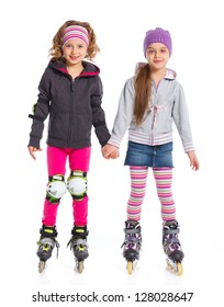 Two cute girls holding hands wearing roller skates. Isolated on a white background