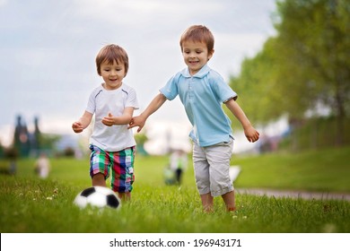 Two Cute Little Boys, Playing Football