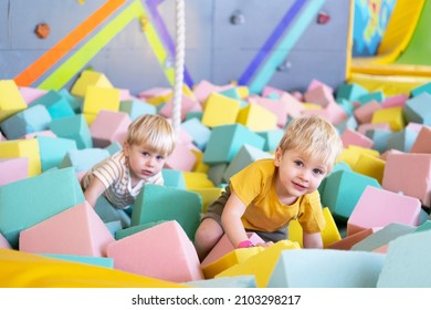 Two Cute Little Boys Twins Plays With Soft Cubes In The Dry Pool In Play Center