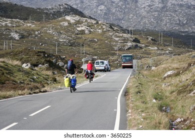 Two Cyclist Cycling Along Narrow Road Outer Hebrides Scotland