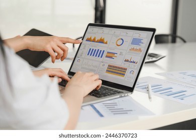 Two data analysts Working on data analysis dashboard for business strategy - Powered by Shutterstock