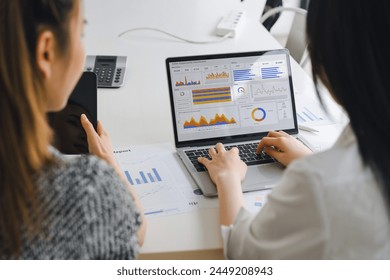 Two data analysts Working on data analysis dashboard for business strategy