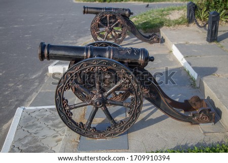 Two decorative old style copper cannons