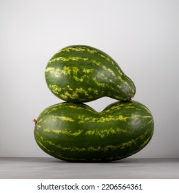 Two Deformed Ugly Watermelon Fruits. Curved Watermelon. Concept - Food Waste Reduction. Eating Imperfect Foods.