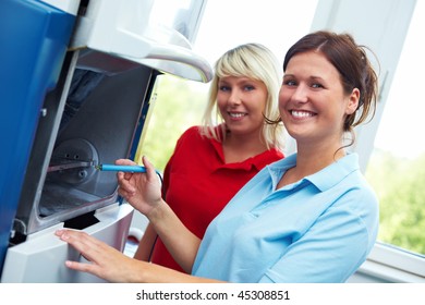 Two Dental Technicians With A CAD/CAM Sytem