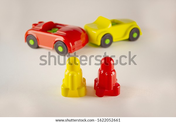 Two\
desperate men near toy cars involved in accident, conceptual image\
with miniatures and figurines on white background. Close-up of a\
collision of two toy cars on a white\
background