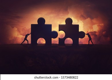 Two determined businessman pushing big jigsaw puzzle pieces to unite and complete the purpose. Business teamwork concept, achieving success together by joining forces. Group cooperation process.