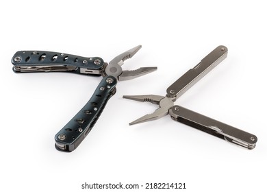 Two different multi-tools with metal handles and open pliers on a white background - Shutterstock ID 2182214121