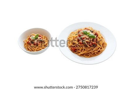 Two different portion sizes of spaghetti pasta with tomato sauce, basil, and parmesan on white background.