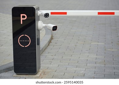 Two digital security cameras installed at a restricted parking entrance for vehicle surveillance close-up. Smart security cameras integrated with parking barrier system for automated access control