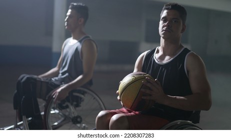 Two Disabled Hispanic Basketball Players . Portrait Of A Young South American Man Looking At Camera