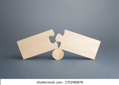 Two disassembled puzzles. Stop of work process and destruction of integrity due to obstacles or circumstances. Failure, inability to correct situation. Problem solving, finding the cause. Concept - Shutterstock ID 1701980878