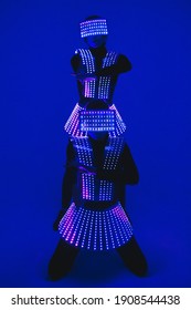 Two  disco dancers move in UV costumes.