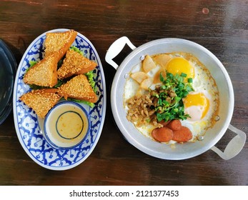 Two dishes of Thai-Vietnamese breakfast include sunny-side up egg and shrimp bread 