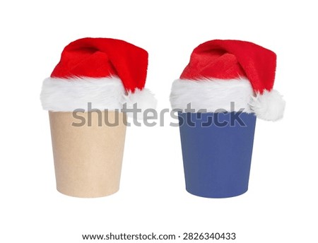 Two disposable coffee cups topped with red Santa hats evoke festive holiday spirit and gift-giving ideas.