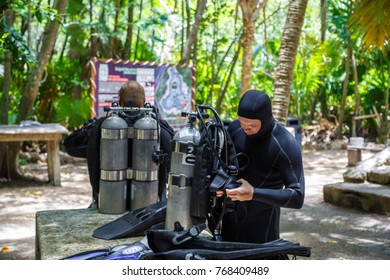 Two Divers Preparing To Dive. Cylinders For Diving. Cave Diving. Mexico