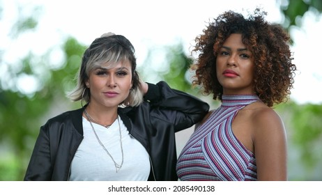 
Two Diverse Brazilian Women Standing Outside Looking At Camera.