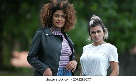 Two Diverse Women Standing Outside In Street. Two Friends Hanging Together