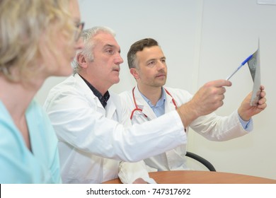 Two Doctor Checking X Ray Film