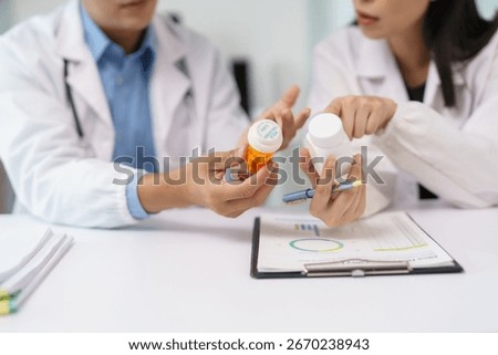 Two doctors comparing different pills during a medical meeting, analyzing pharmaceutical products and treatment options
