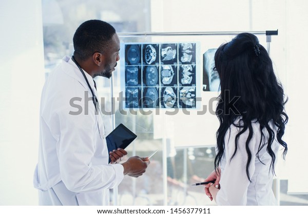 Two Doctors Look Xray Discuss Diagnosis Stock Photo 1456377911 ...