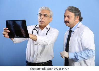 Two Doctors Posing On Different Backgrounds