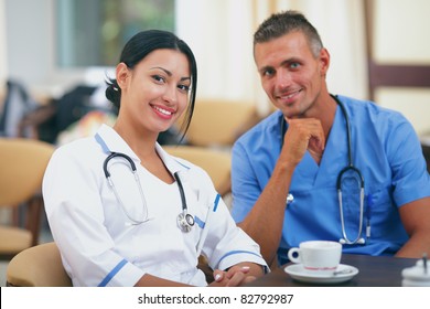 Two Doctors Relaxing In The Staff Room In A Hospital