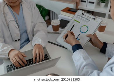 two doctors sat in a private office at the hospital discussing and exchanging knowledge with each other, doctors discussed the way that would be the most appropriate treatment, stethoscope, specialist - Powered by Shutterstock