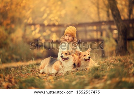 Similar – Foto Bild fröhliches Kind Mädchen mit einem Korb voller Äpfel, das mit ihrem Hund spielt.