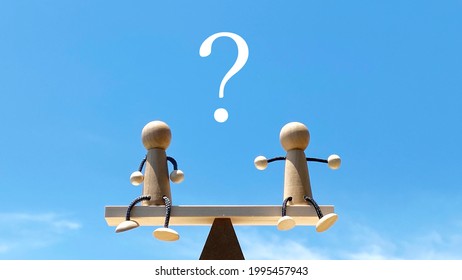 Two dolls on a balance pole_blue sky background_question