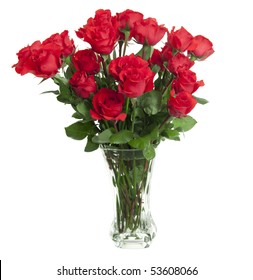 Two Dozen Red Roses Isolated On White Background With The Green Stems In A Large Glass Vase With Water. Copyspace On All Four Sides.