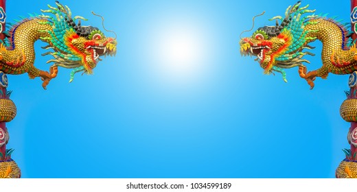 Two dragon statues on the left and right. Bright sky background with sun in the middle