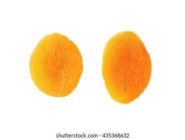 two dried apricots isolated on a white background
