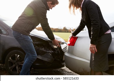 Two Drivers Arguing Over Damage To Cars After Accident